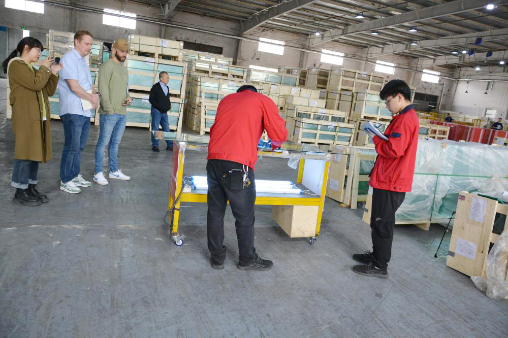 INR manager in APIS glass factory.jpg
